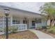 Inviting front entrance with decorative concrete block, lush landscaping, and a stylish light fixture at 2171 Chippewa Trl, Maitland, FL 32751