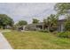 Well-maintained home with a landscaped front yard, decorative breeze block, and welcoming entrance at 2171 Chippewa Trl, Maitland, FL 32751