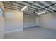Large garage with updated floor and white walls at 2171 Chippewa Trl, Maitland, FL 32751