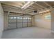 This garage is spacious with an updated ceiling and large garage door at 2171 Chippewa Trl, Maitland, FL 32751