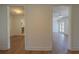 Hallway with views of kitchen and additional living space with recessed lighting and sleek flooring at 2171 Chippewa Trl, Maitland, FL 32751