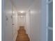Bright hallway with wood-look floors and white walls lead to other rooms at 2171 Chippewa Trl, Maitland, FL 32751