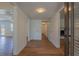 Hallway with laminate floors providing access to various rooms of the home at 2171 Chippewa Trl, Maitland, FL 32751