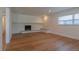 Spacious living room featuring a traditional brick fireplace with a wooden mantel at 2171 Chippewa Trl, Maitland, FL 32751