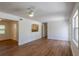 Open-concept living area with kitchen access, natural light, fan, and sleek flooring at 2171 Chippewa Trl, Maitland, FL 32751