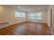 Bright living room featuring hardwood floors, large windows, and neutral decor, providing a versatile living space at 2171 Chippewa Trl, Maitland, FL 32751