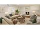 Bright living room featuring a fireplace, neutral furniture, and hardwood flooring at 2171 Chippewa Trl, Maitland, FL 32751