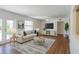 Inviting living room boasting natural light, wood floors, and a comfortable layout at 2171 Chippewa Trl, Maitland, FL 32751