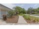 Well-maintained front yard with lush landscaping and a paved pathway leading to the home at 2171 Chippewa Trl, Maitland, FL 32751