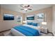 Bedroom with a Queen-size bed, two side tables, and two windows with outside views at 2316 Irlo Dr, Kissimmee, FL 34741