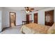 Comfortable bedroom featuring a ceiling fan and an en-suite bathroom at 2316 Irlo Dr, Kissimmee, FL 34741