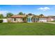 Charming single-story home with a lush lawn and mature landscaping at 2316 Irlo Dr, Kissimmee, FL 34741
