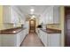 Galley kitchen featuring white cabinetry, and a full appliance package at 2316 Irlo Dr, Kissimmee, FL 34741