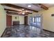 Living room showcasing wood beams, tile floors, and access to the sunroom at 2316 Irlo Dr, Kissimmee, FL 34741