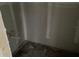 Incomplete bathroom showcases exposed plumbing and wiring amidst bare drywall and concrete floors at 2383 Zuni Road, St Cloud, FL 34771