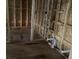 A bathroom under construction, showcasing plumbing work and stud framing at 2383 Zuni Road, St Cloud, FL 34771