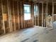 Bedroom with a window and stud framing under construction at 2383 Zuni Road, St Cloud, FL 34771