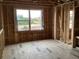Bedroom framing showcases a large window with a view of the outdoors at 2383 Zuni Road, St Cloud, FL 34771