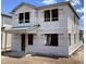 Image shows exterior of home under construction with exposed framework and weather-resistant sheathing materials at 2383 Zuni Road, St Cloud, FL 34771