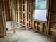 Framing of a room with a window, electrical wiring, and view of a backyard at 2383 Zuni Road, St Cloud, FL 34771