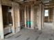 Interior framing of a new construction home with visible studs, wiring, and plumbing at 2383 Zuni Road, St Cloud, FL 34771