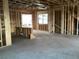 Unfinished interior shows exposed wooden framing, concrete flooring, and plumbing rough-in at 2383 Zuni Road, St Cloud, FL 34771