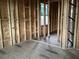 Framing of a room showing a window and insulation at 2383 Zuni Road, St Cloud, FL 34771