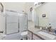 Clean bathroom with shower-tub combination and granite vanity at 25409 Waterbrook Ct, Leesburg, FL 34748