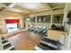 A spacious hall from above showcasing a stage, tables, chairs, and elegant chandeliers at 25409 Waterbrook Ct, Leesburg, FL 34748