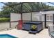 Relaxing hot tub area within a screened lanai, adjacent to the pool and seating at 25409 Waterbrook Ct, Leesburg, FL 34748