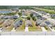 Aerial view of a neighborhood with well-maintained homes, green lawns, and easy access to the nearby highway at 2541 Bobby Lee Ln, St Cloud, FL 34772