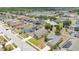 Aerial view of a beautiful community with homes surrounding a tranquil lake and lush greenery at 2541 Bobby Lee Ln, St Cloud, FL 34772