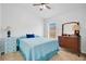 Cozy bedroom with natural light, a ceiling fan, and neutral carpet flooring at 2541 Bobby Lee Ln, St Cloud, FL 34772