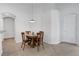 Cozy dining area with a round table and seating for four, adjacent to the kitchen at 2541 Bobby Lee Ln, St Cloud, FL 34772