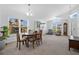 Bright dining area with ample natural light, elegant furnishings, and open layout at 2541 Bobby Lee Ln, St Cloud, FL 34772