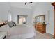Serene primary bedroom with vaulted ceilings, closet, and sliding door access to the patio at 2541 Bobby Lee Ln, St Cloud, FL 34772