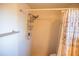 The bathroom features a tiled shower stall with a showerhead and a floral shower curtain at 2708 Burton Ln, Orlando, FL 32817
