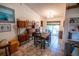 Inviting dining room area with tile floors, sliding glass doors, and stylish mid-century modern shelving at 2708 Burton Ln, Orlando, FL 32817
