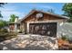 One-story house with a spacious driveway, a two-car garage with a basketball hoop and stone details at 2708 Burton Ln, Orlando, FL 32817