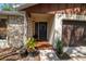 Inviting front porch and entry featuring a tiled entryway, potted plants, and stone accents at 2708 Burton Ln, Orlando, FL 32817