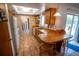 Sunlit kitchen with a breakfast bar, wood cabinets, and tile floors, seamlessly blending functionality with a cozy ambiance at 2708 Burton Ln, Orlando, FL 32817