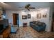 Comfortable living room with tile floors, neutral paint, and comfortable seating at 2708 Burton Ln, Orlando, FL 32817