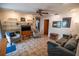 Inviting living room boasting tile flooring, built-in shelving, and comfortable seating, perfect for relaxing and entertaining at 2708 Burton Ln, Orlando, FL 32817