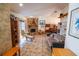 Cozy living room with a stone fireplace, tile floors, and a comfortable seating area at 2708 Burton Ln, Orlando, FL 32817