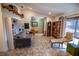 Spacious living room with tile flooring, a bookshelf, a comfortable sofa and lots of natural light at 2708 Burton Ln, Orlando, FL 32817