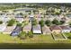 Aerial view of the neighborhood featuring houses bordering a lake and green spaces at 2724 Amanda Kay Way, Kissimmee, FL 34744
