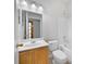 Bathroom featuring a single sink vanity, a white toilet, and a shower-tub combo at 2724 Amanda Kay Way, Kissimmee, FL 34744