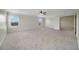 Bright main bedroom with neutral walls, plush carpeting, and large windows with peaceful views at 2724 Amanda Kay Way, Kissimmee, FL 34744