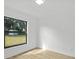 Bright bedroom with a large window and view of a grassy backyard at 274 W 20Th St, Apopka, FL 32703