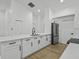 Stylish kitchen with modern white cabinetry, stainless steel appliances, and a large center island with seating at 274 W 20Th St, Apopka, FL 32703